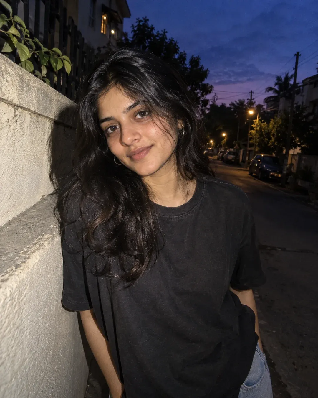 Example result: A lofi flash portrait at blue-hour dusk on a quiet street, with a slightly overexposed face and a deep blue sky behind.